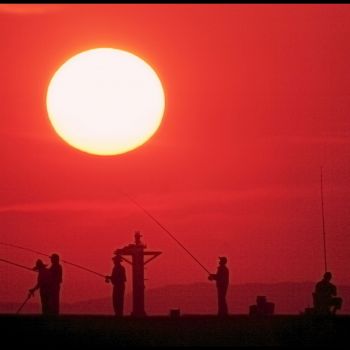 夕日と釣り人